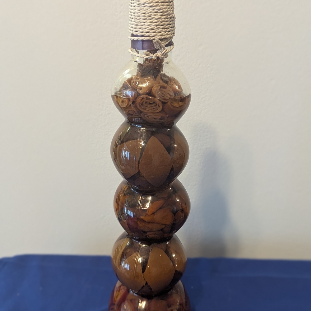 Decorative Glass Bottle with Dried Leaves